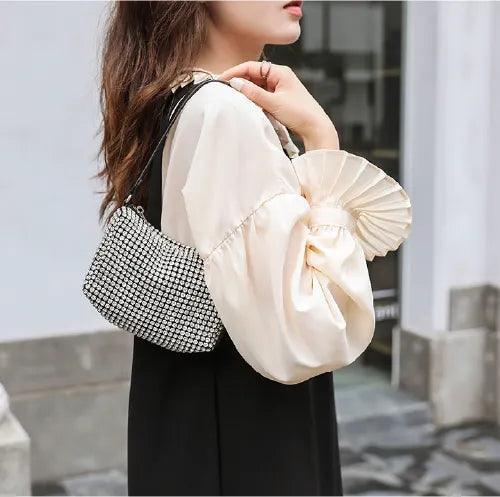 BORSA COMPATTA CON BORCHIE - LUXURY