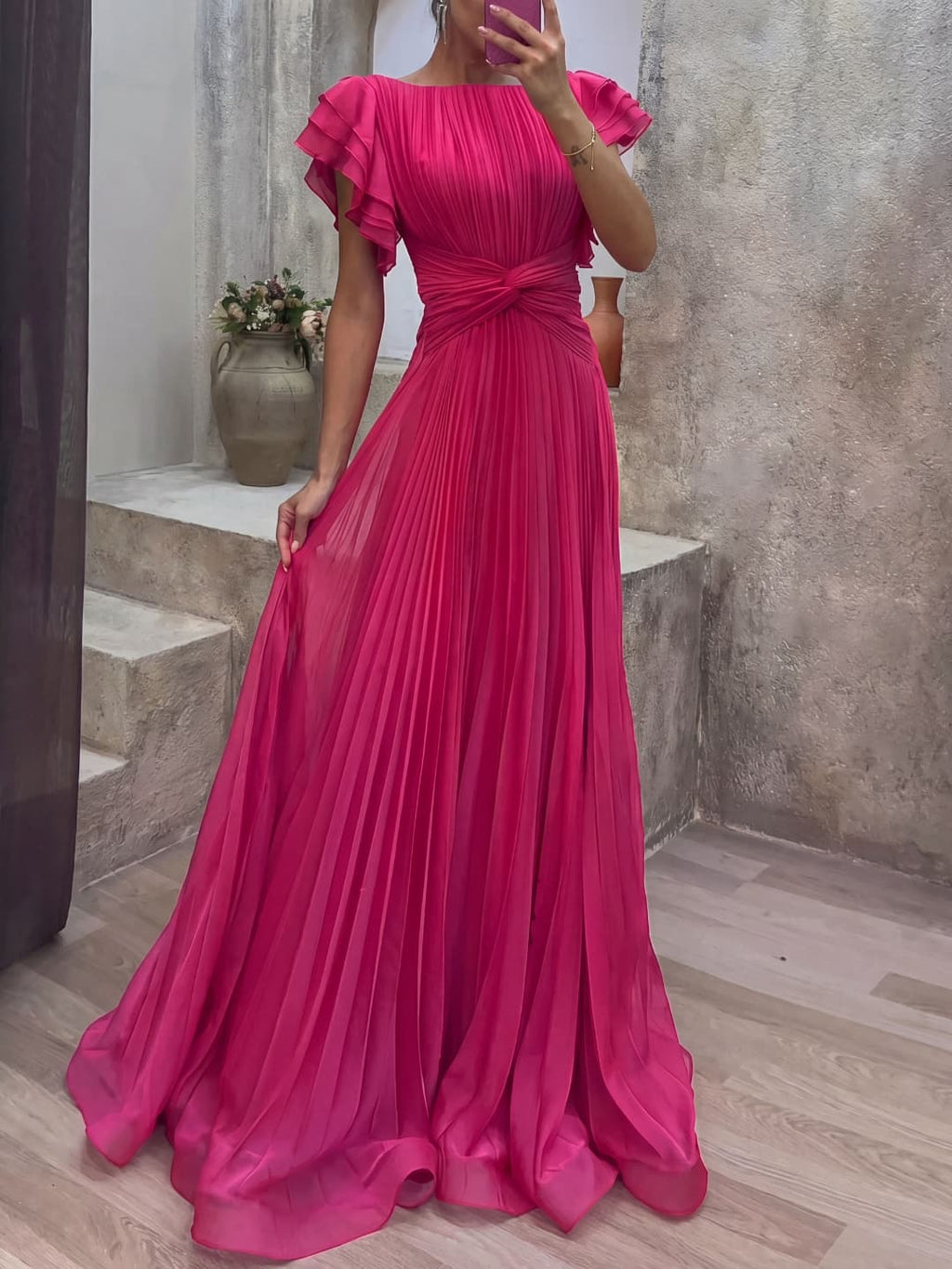 Pleated dress with knotted detail