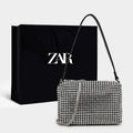 BORSA COMPATTA CON BORCHIE - LUXURY