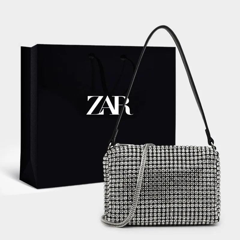 BORSA COMPATTA CON BORCHIE - LUXURY